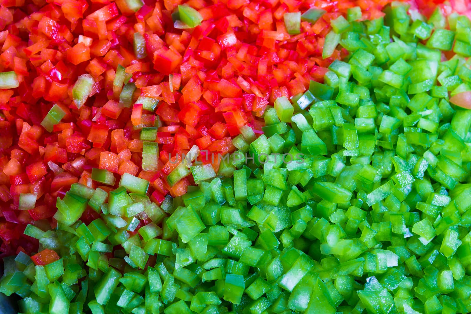 Green and red belll peppers cleaned and washed as cooking Ingredient in the restaurant, background