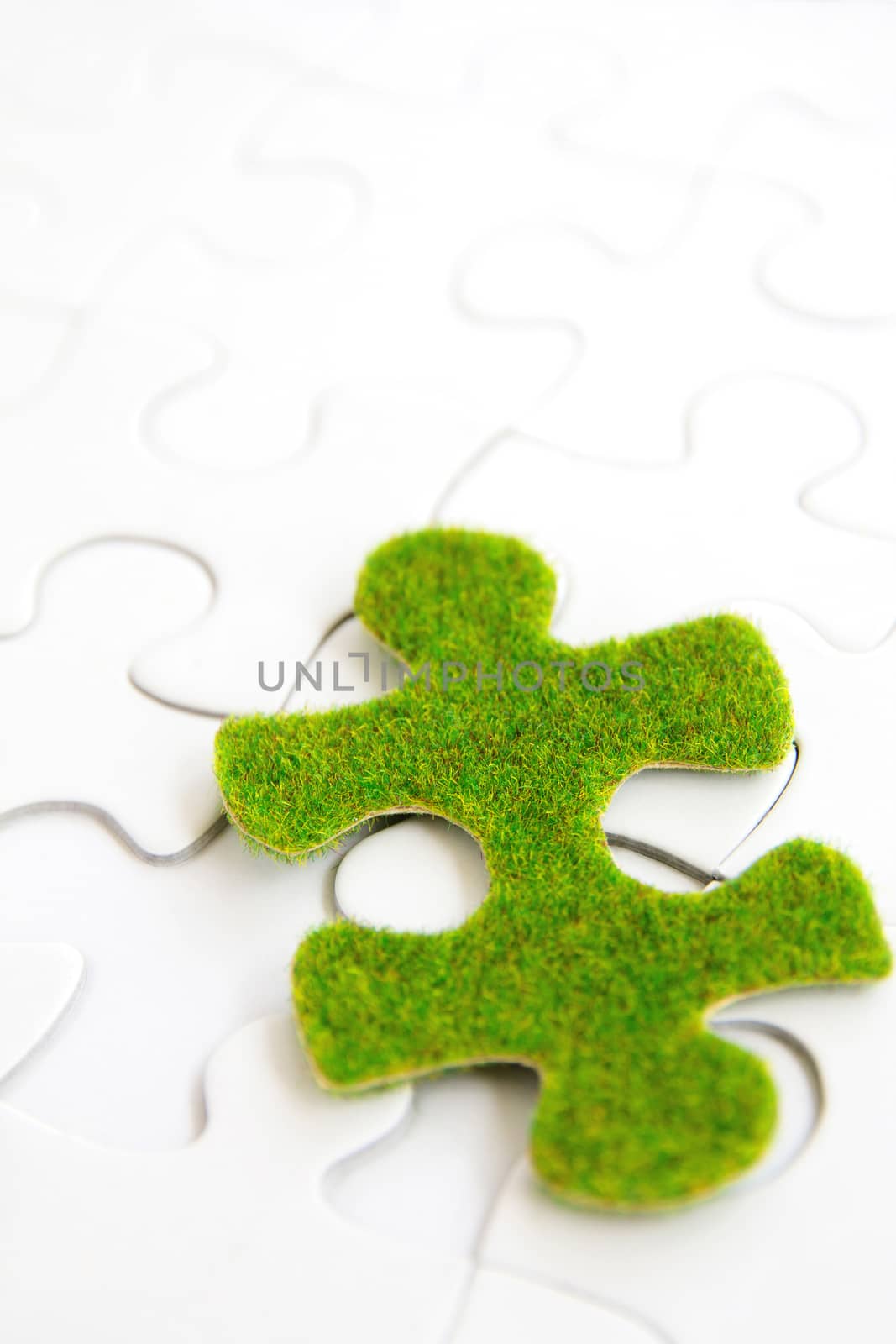 green puzzle piece, green space concept