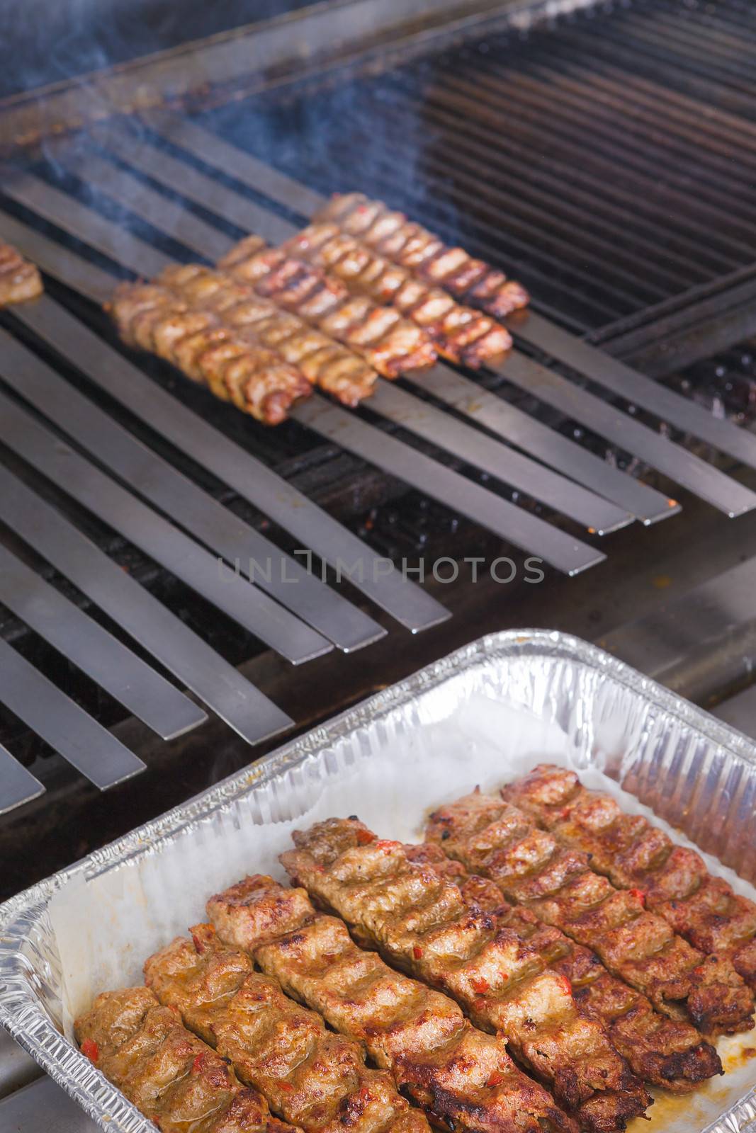 Cooking Adana Lamb Kebabs on the Restaurant Style Grill by coskun