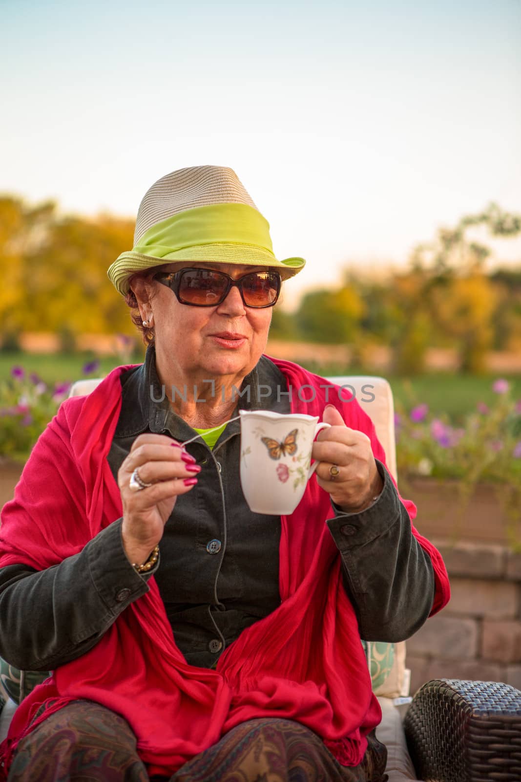 Tea Time to Stay Warm, Senior Lady with her Hot Tea by coskun