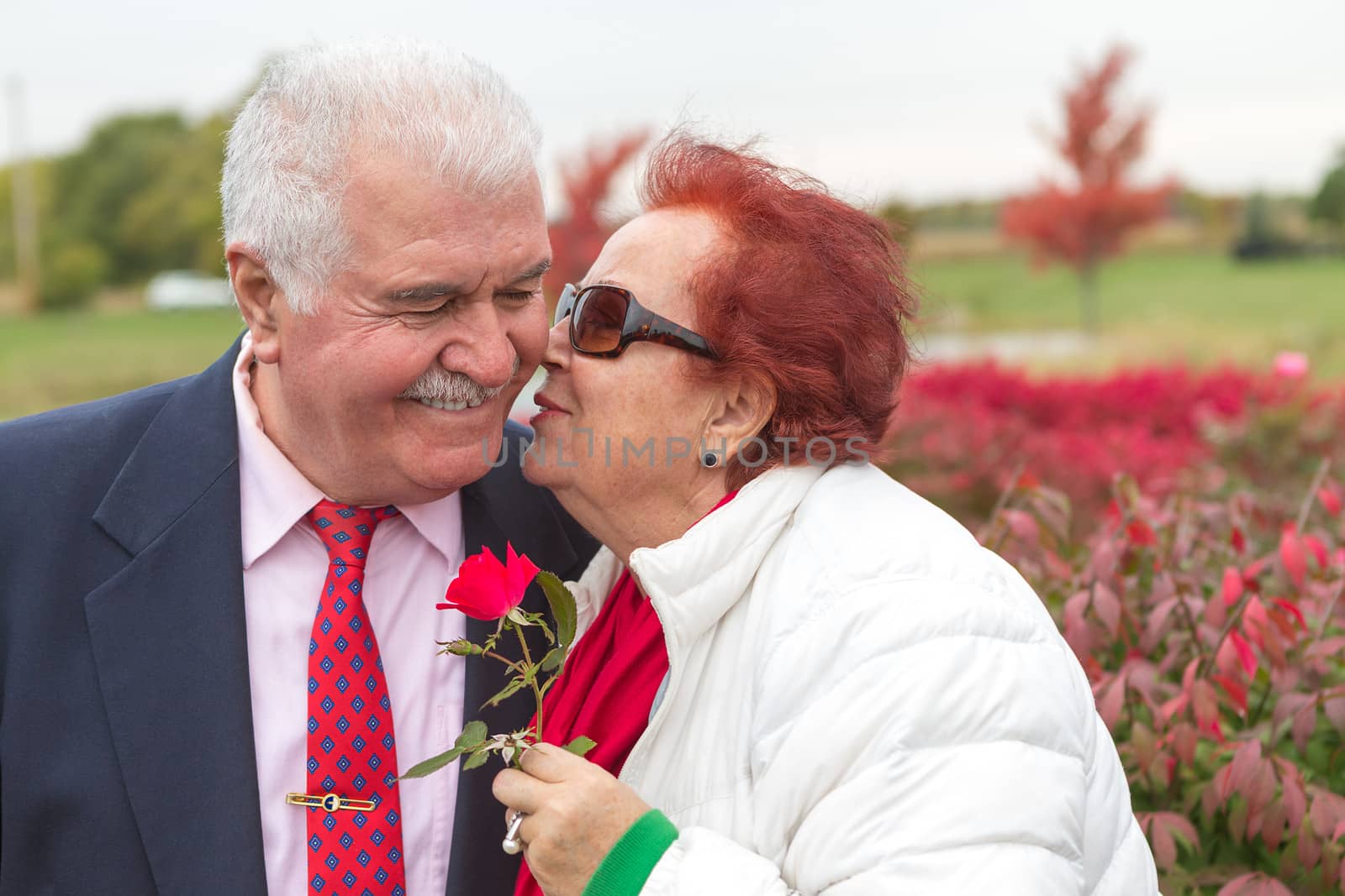 Love is in the air, perhaps she just received the rose from her husband and giving the return kiss