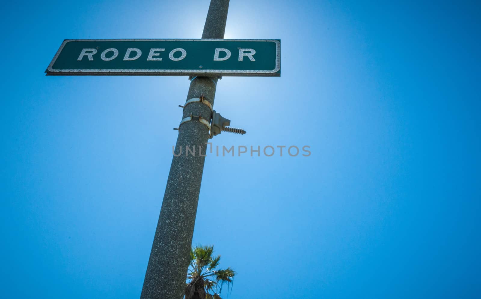 Rodeo Drive Strret sign in Beverly Hills sunlight 2013