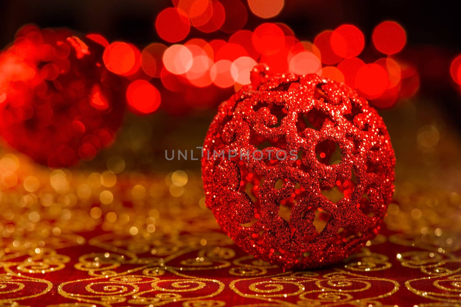 Red Christmas ornaments with red blur lights