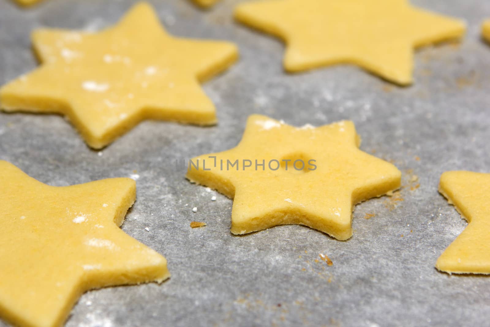 cookie cutter as stars raw on baking paper
