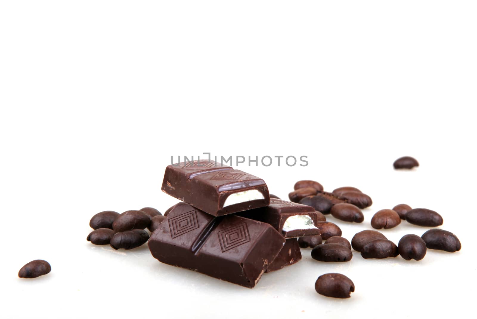 Chocolate And Coffee Isolated On White