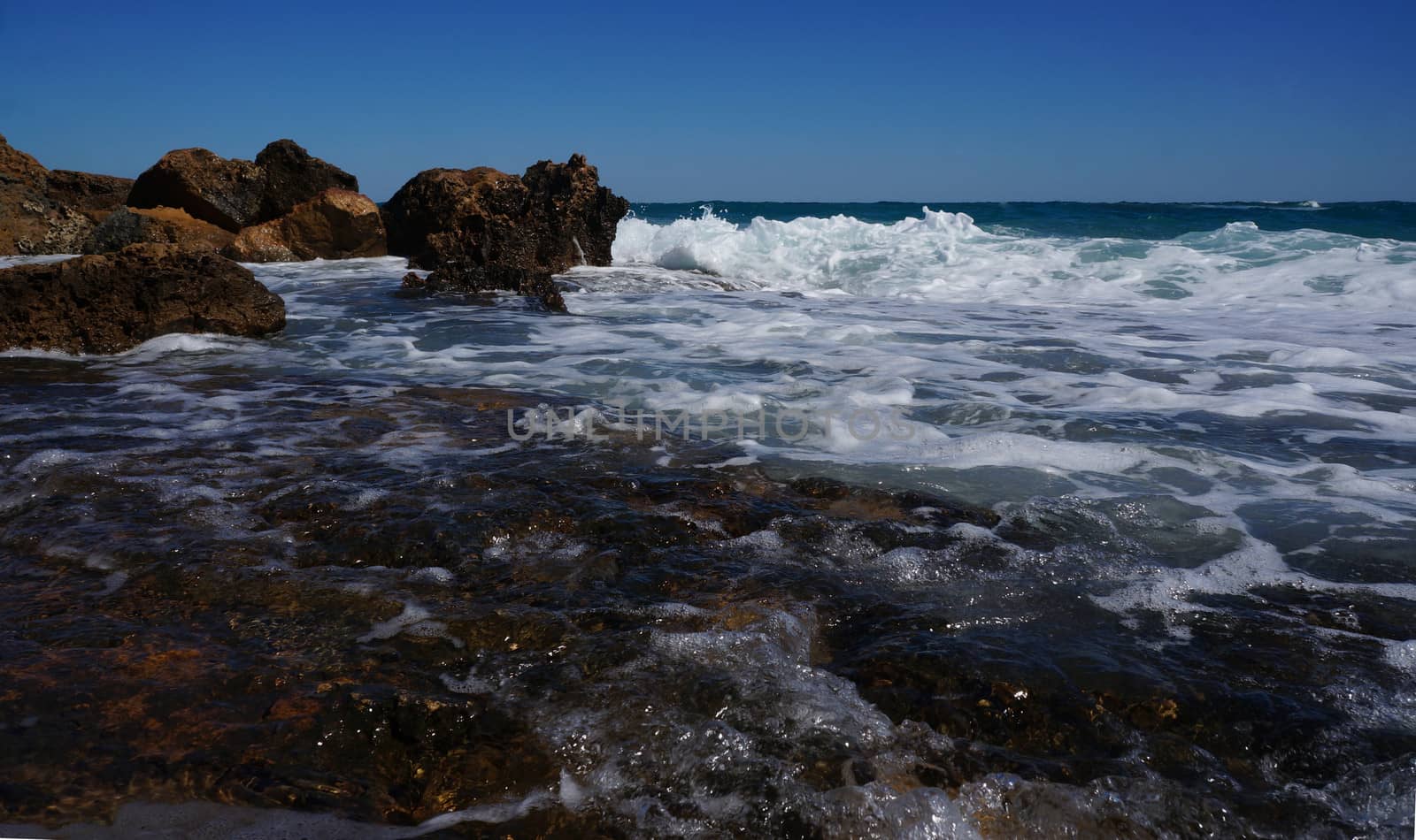Huge rocks on the coast of the storm sea