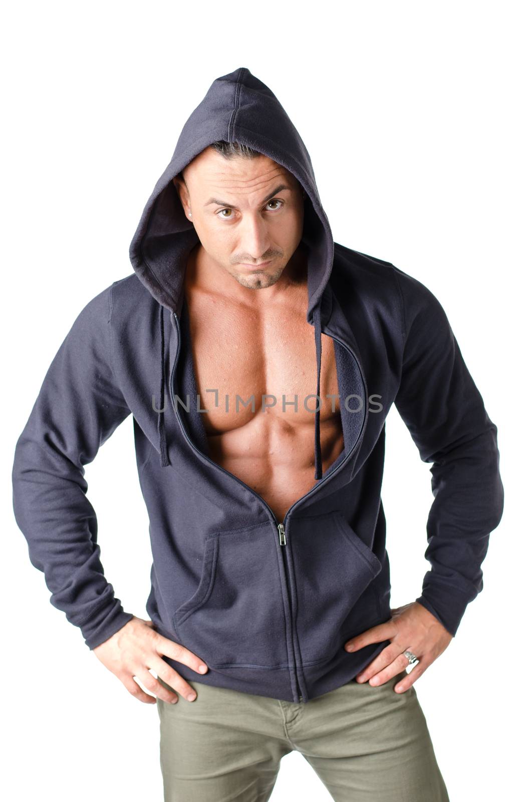 Muscular man with open blue hoodie bare chested, isolated on white