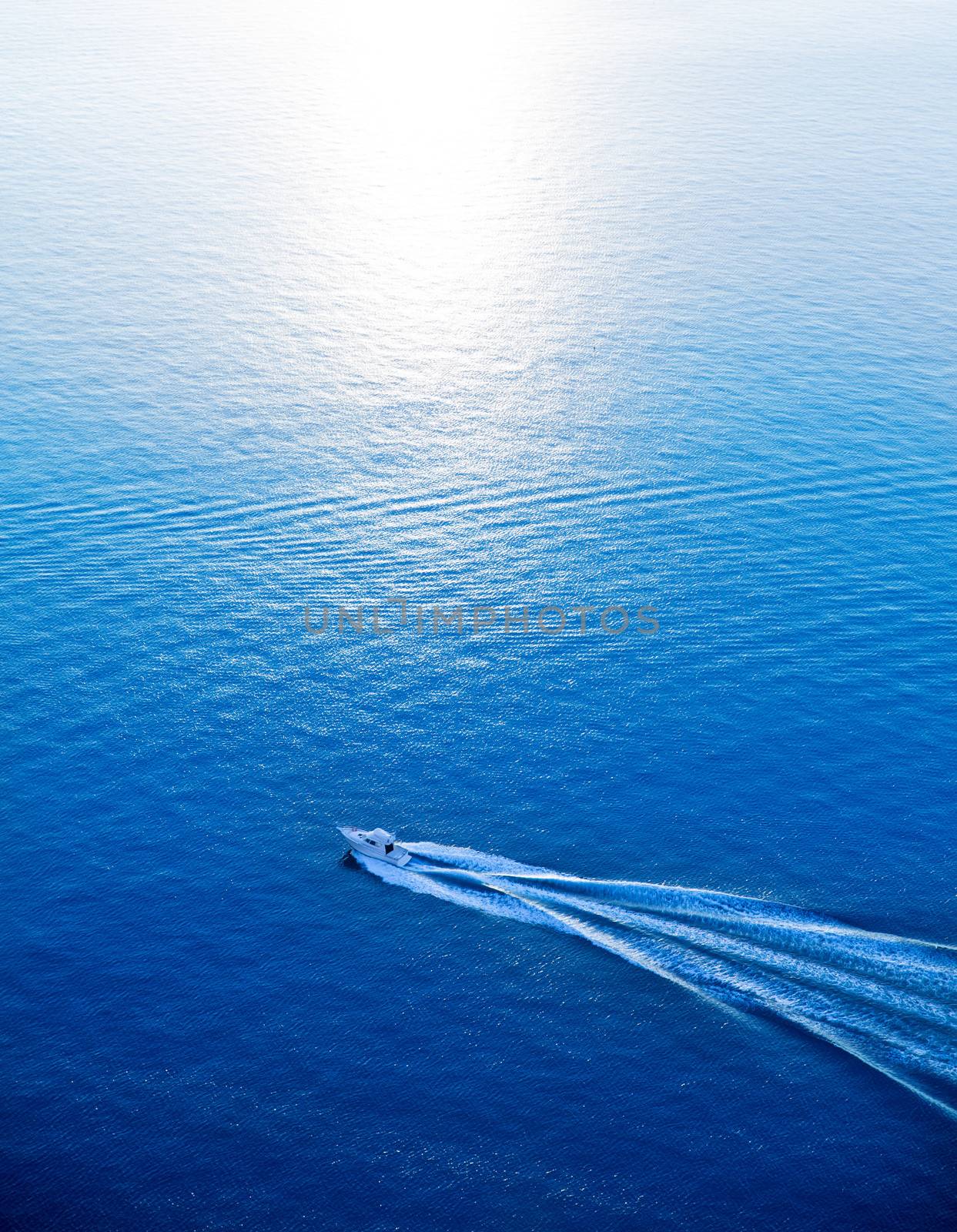 Boat cruising blue Mediterranean sea aerial view by lunamarina