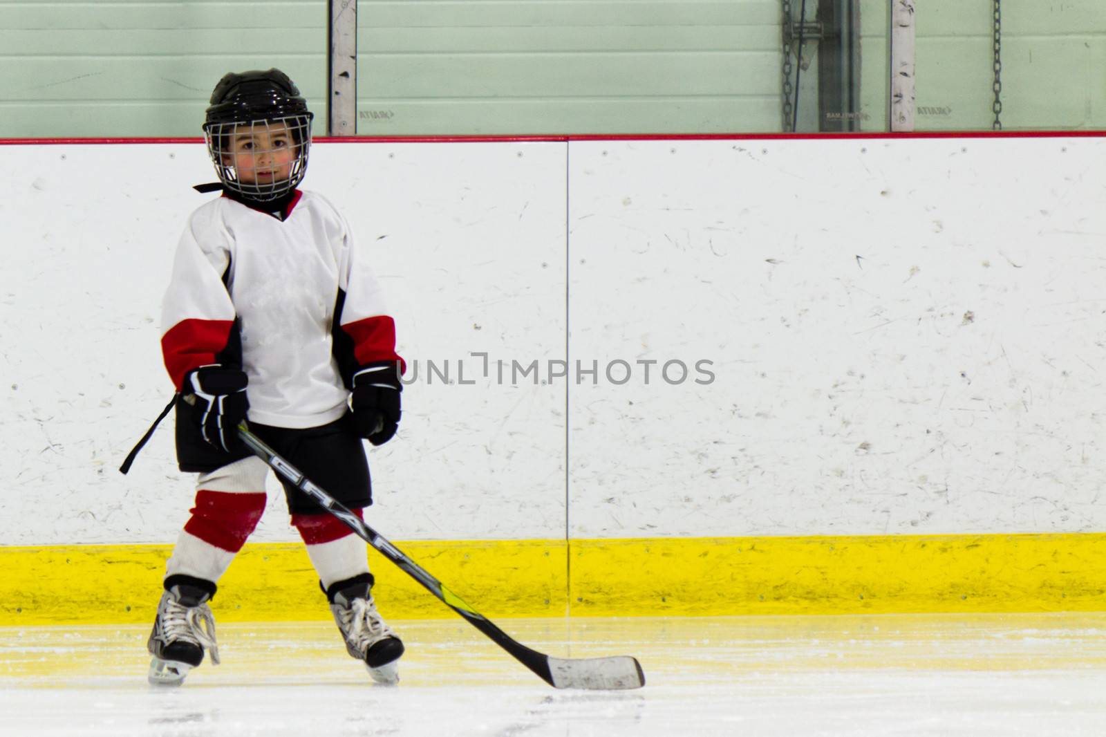 Child playing ice hockey