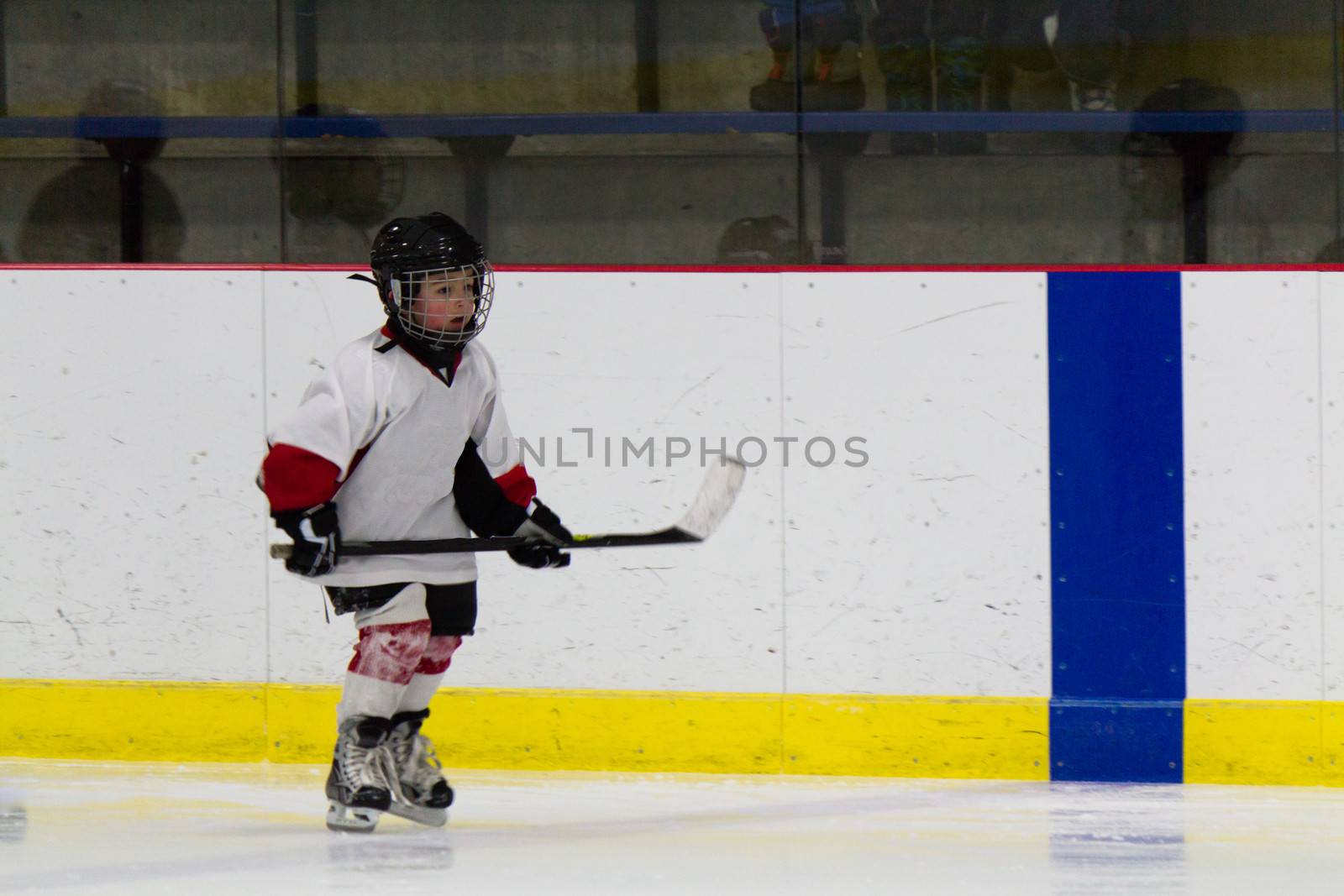 Child playing ice hockey