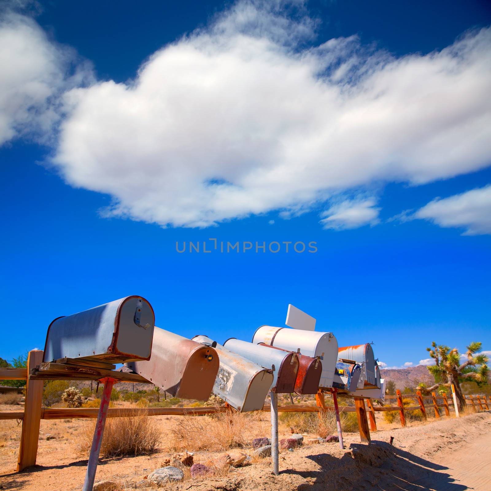 Grunge mail boxes in a row at California Mohave desert USA