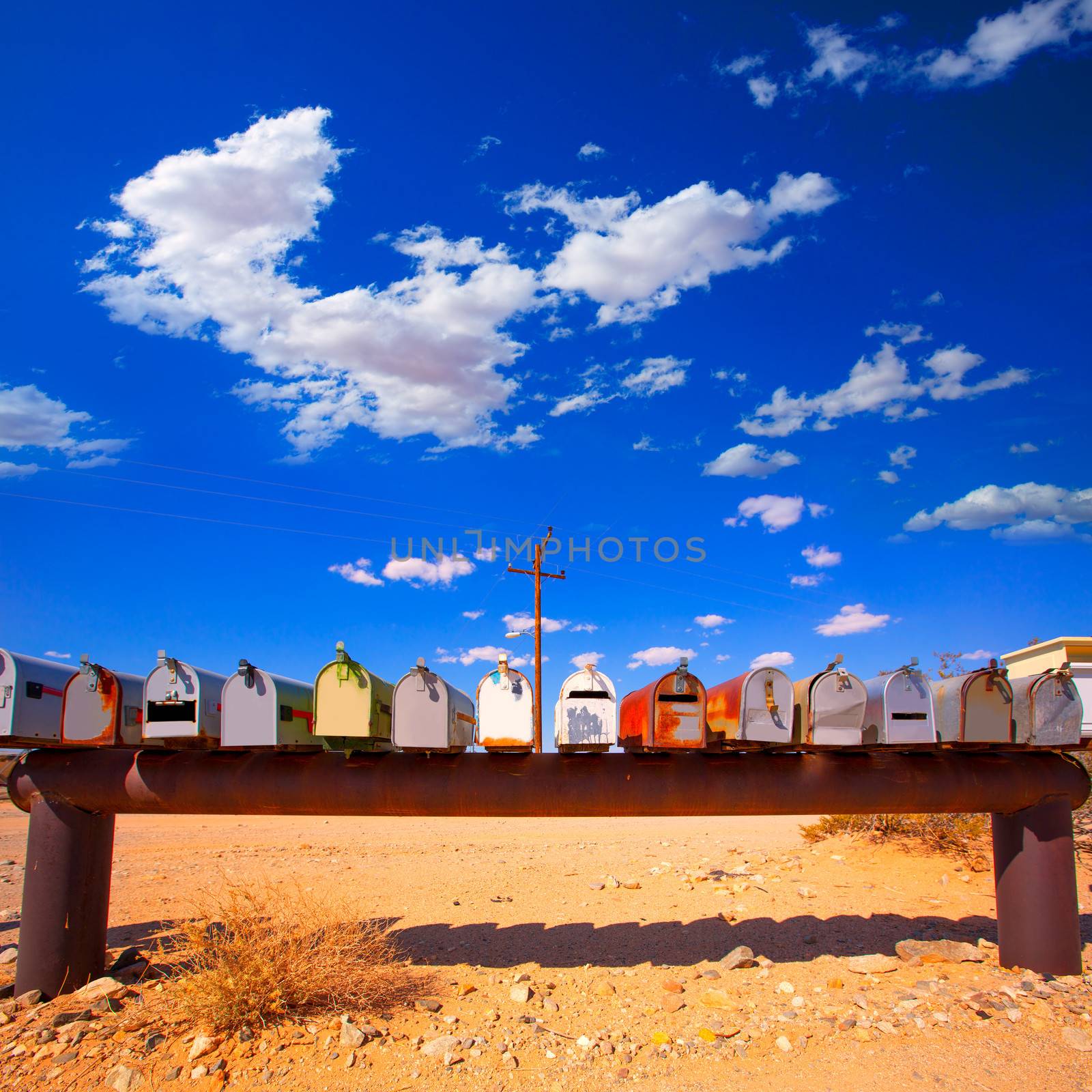 Grunge mail boxes in a row at California Mohave desert USA