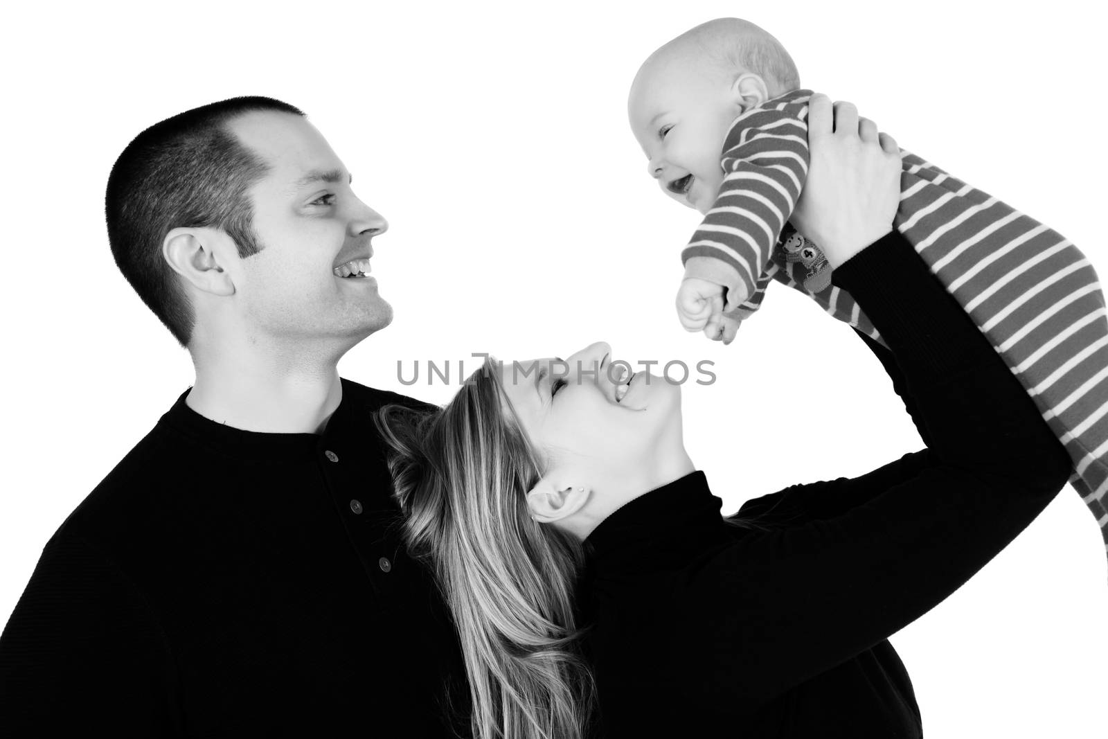 Baby boy and his parents against white background