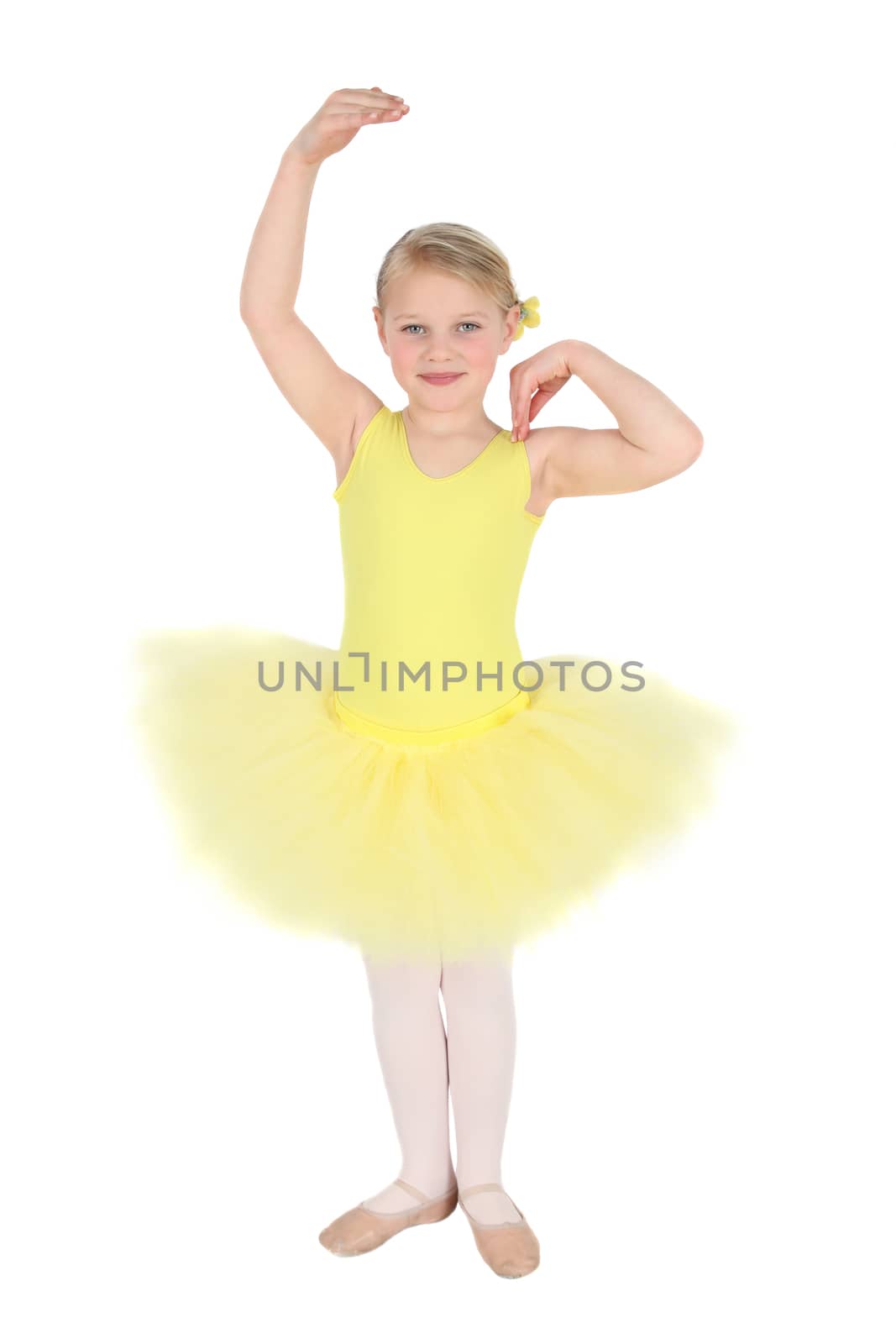 Blond girl wearing a yellow ballet tutu on white background