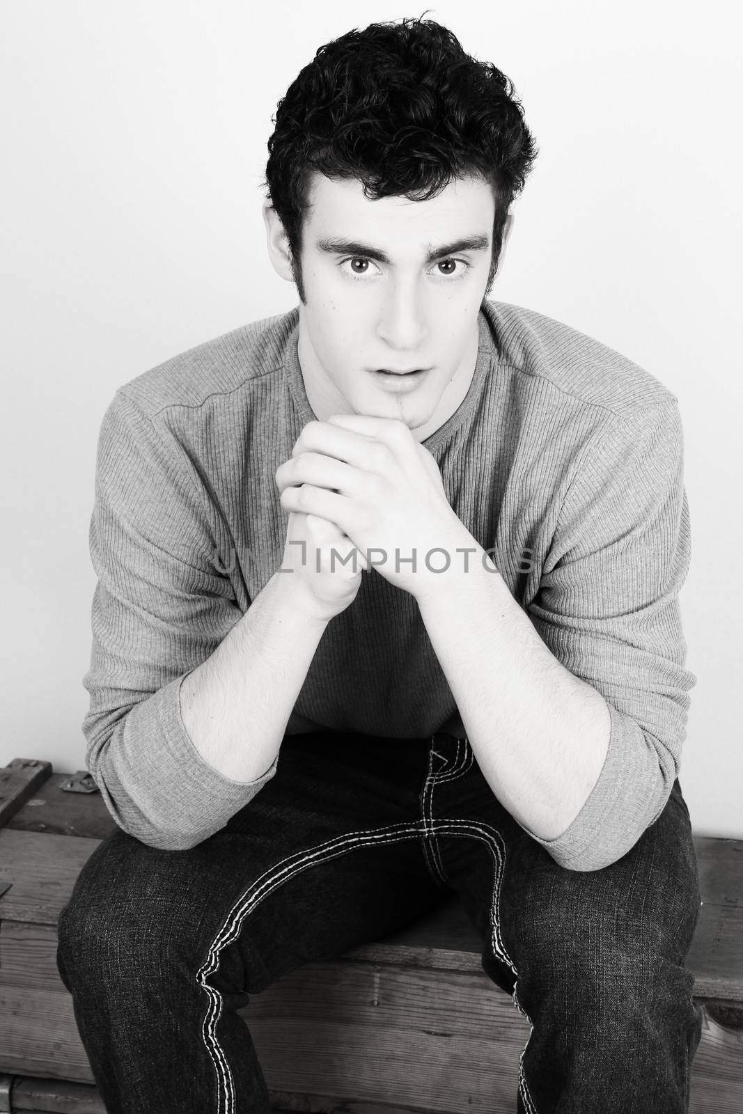 Attractive brunette male model in casual grey shirt