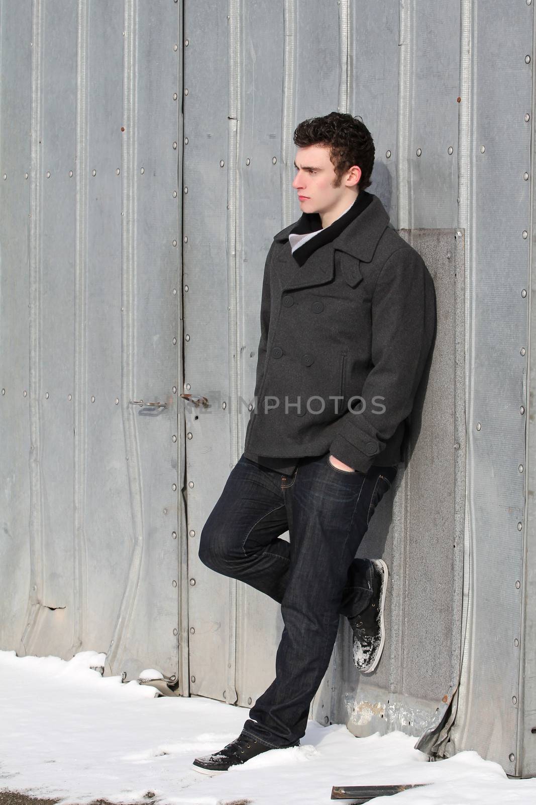 Attractive brunette male outside on a cold winters day