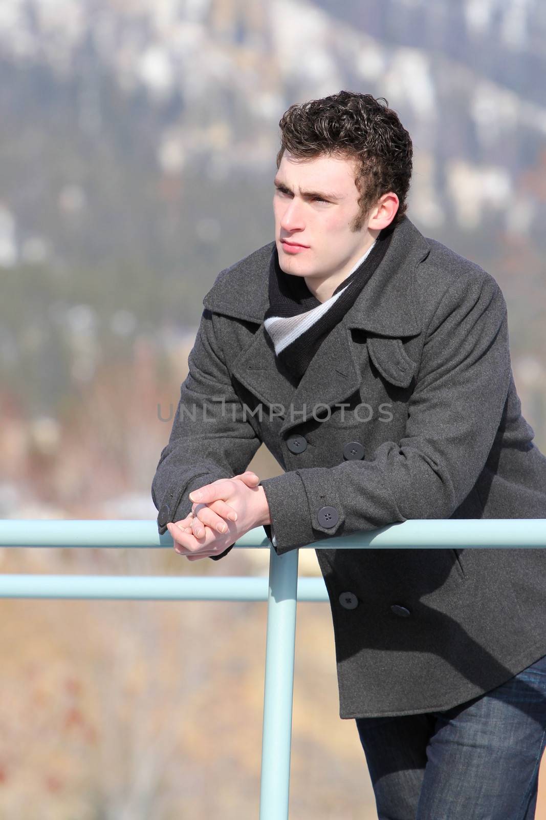 Attractive brunette male outside on a cold winters day