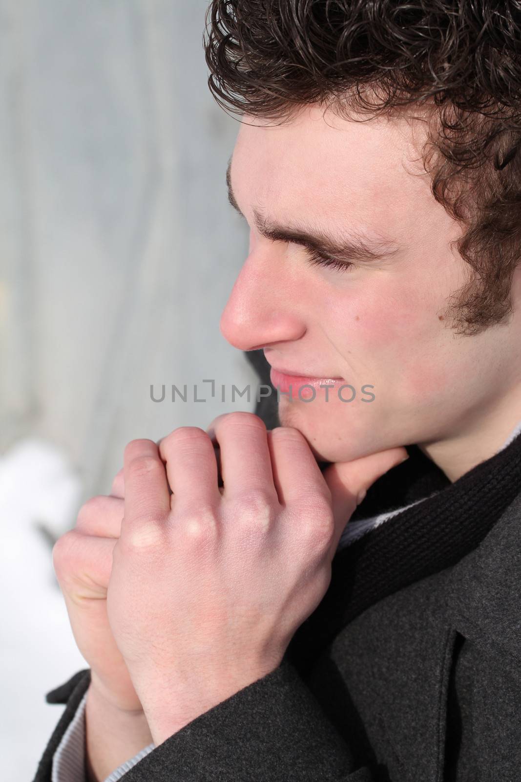 Attractive brunette male outside on a cold winters day