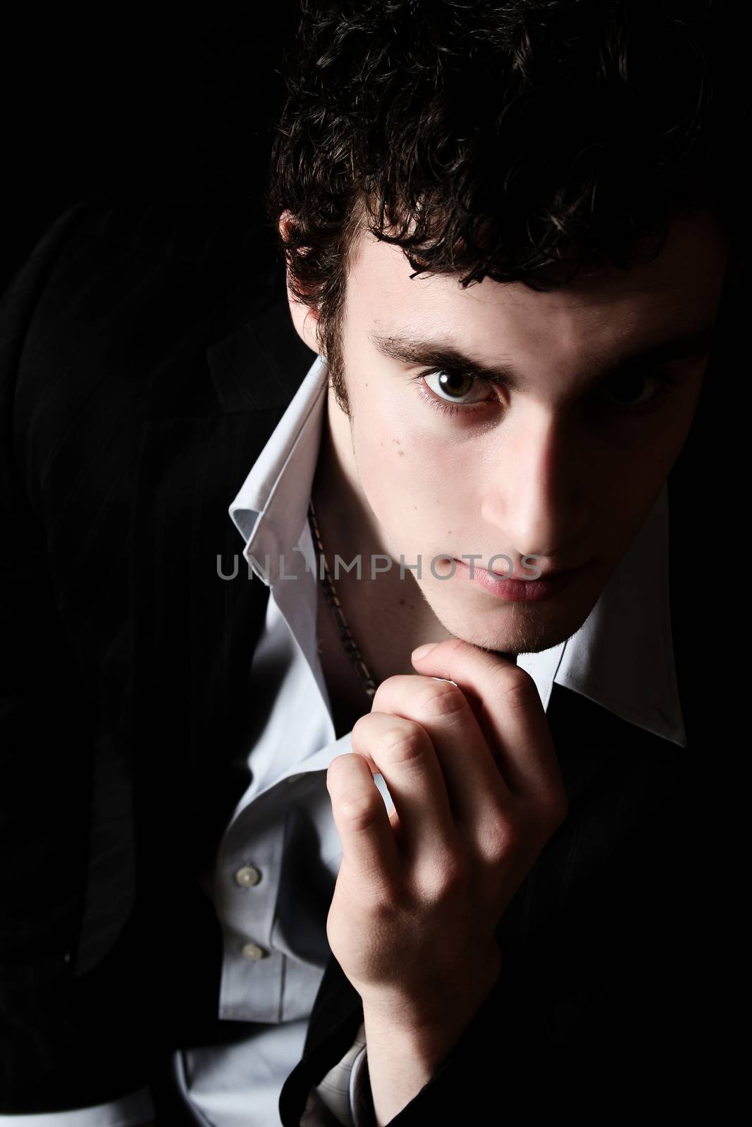 Attractive brunette male model in black dress shirt