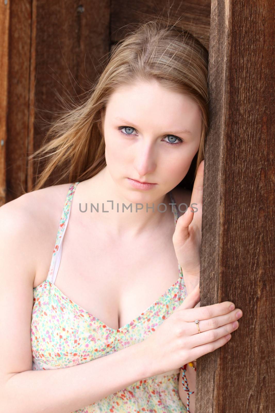 Beautiful blond model outdoors in rural setting natural light
