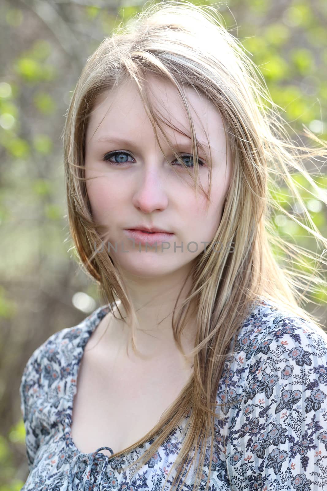 Beautiful blond model outdoors in rural setting natural light