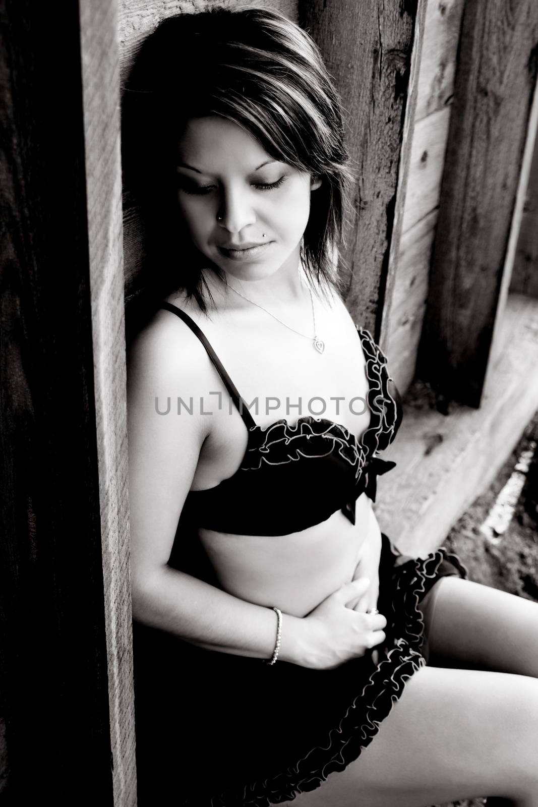 Beautiful brunette in lingerie against textured background