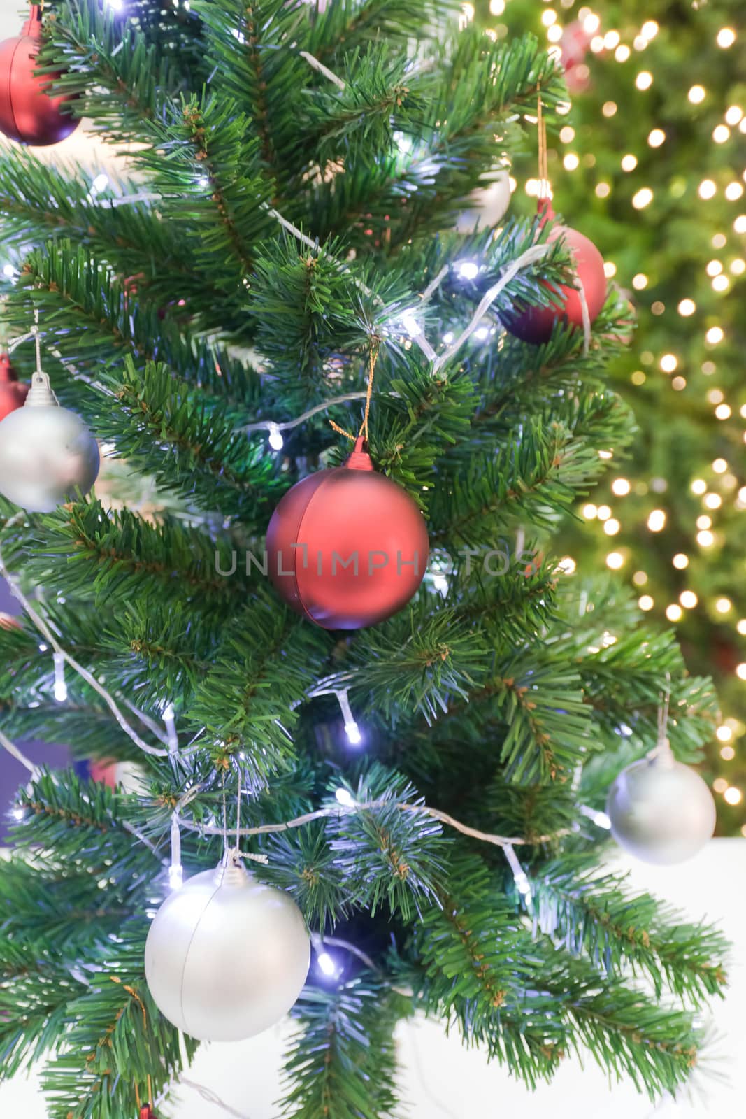 Background image of a Christmas tree decorated with lights