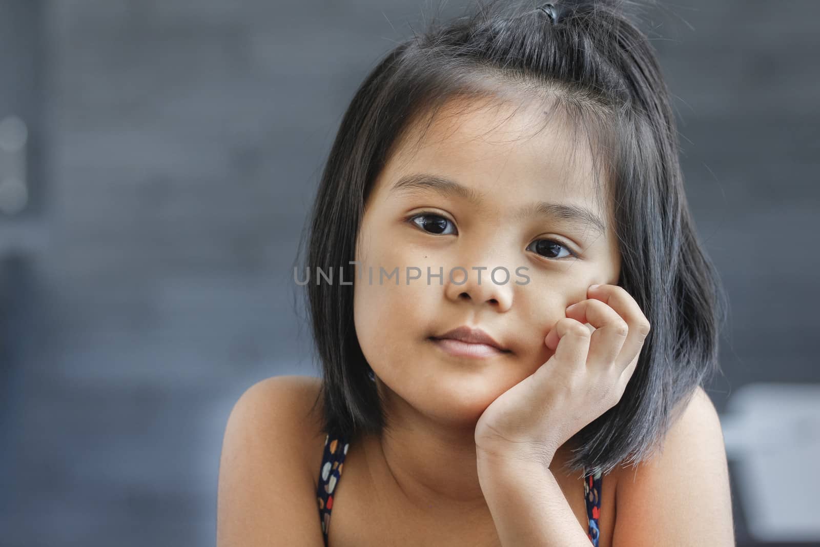 Relaxing time of asian children on sofa