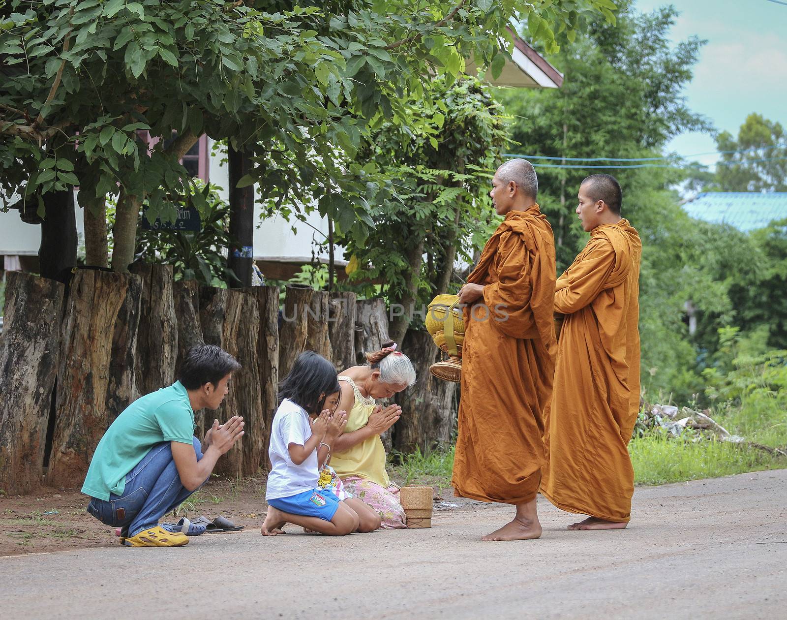 Loei province , Thailand - JULY 18: Every day very early in the morning, Thai people donated food to the monks on july 18, 2013 in Loei province , Thailand