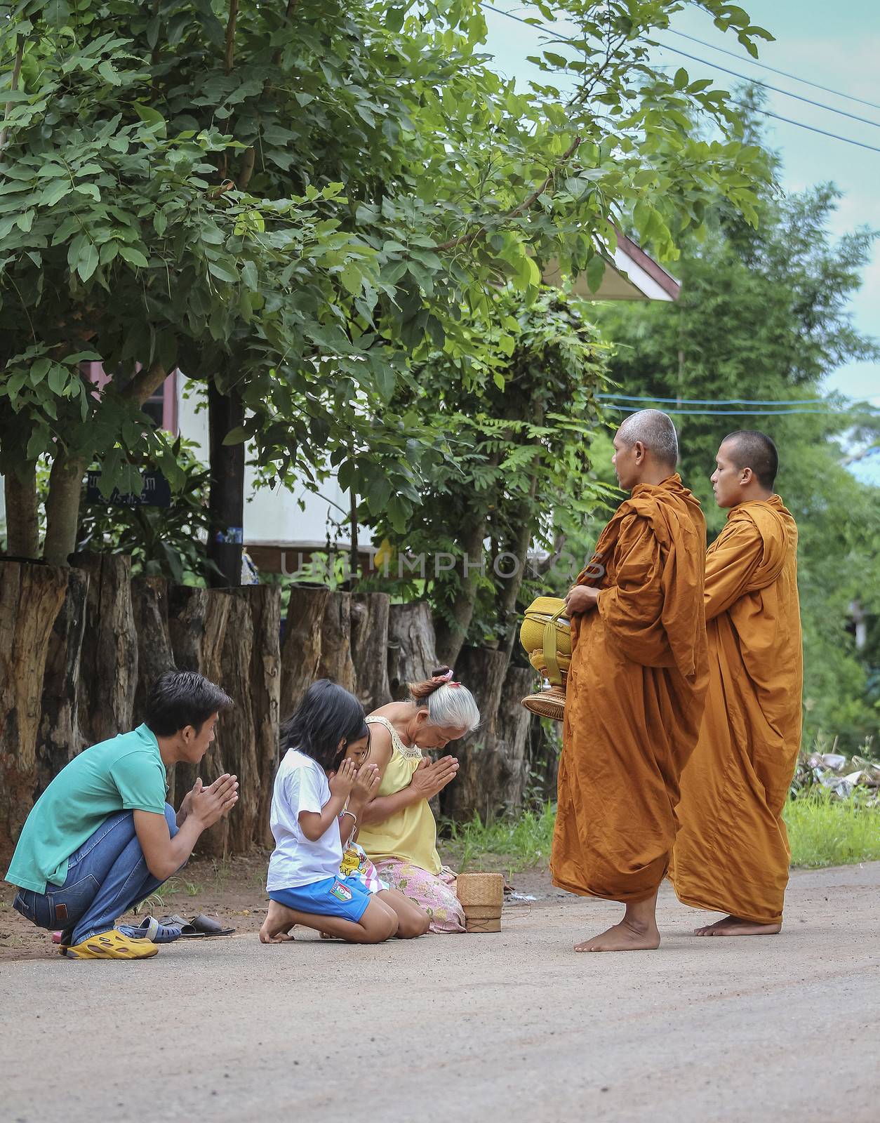 Loei province , Thailand - JULY 18: Every day very early in the morning, Thai people donated food to the monks on july 18, 2013 in Loei province , Thailand