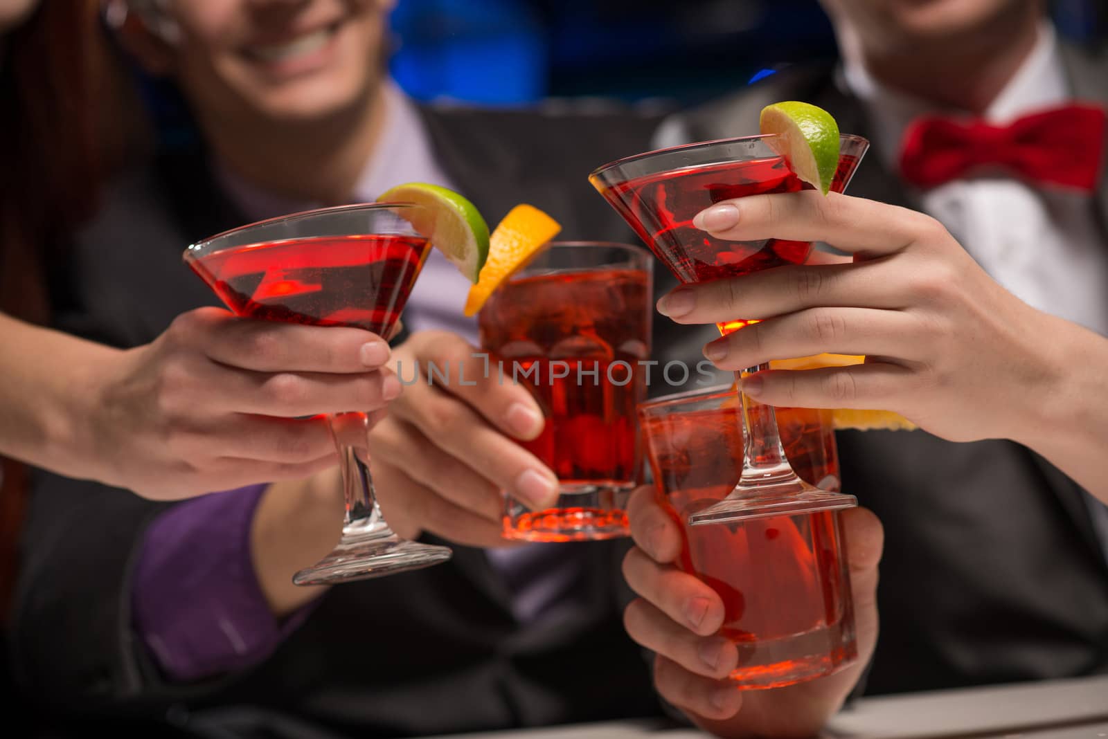 close-up of hands with glasses, a toast, party with friends