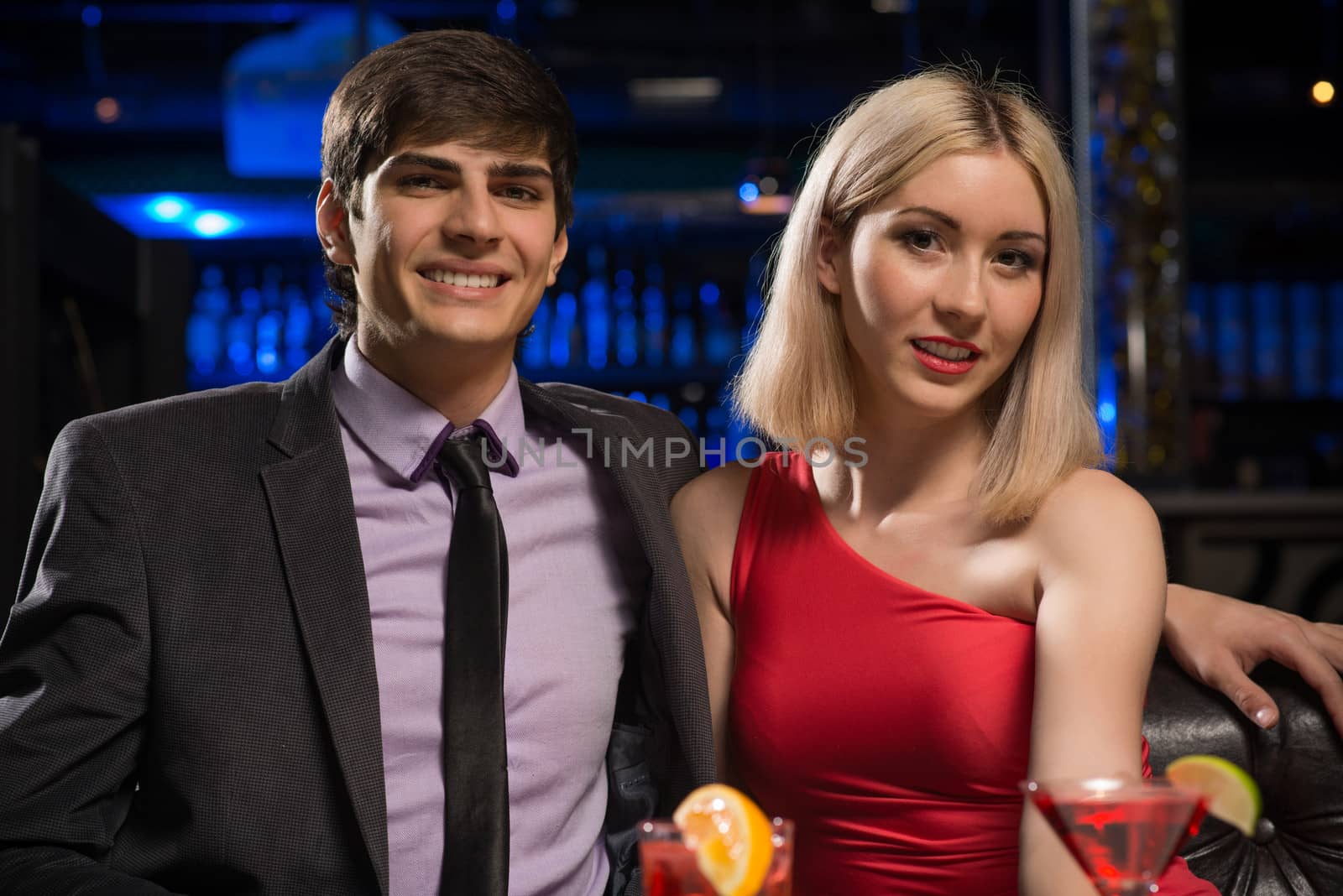 Young couple talking in a nightclub by adam121