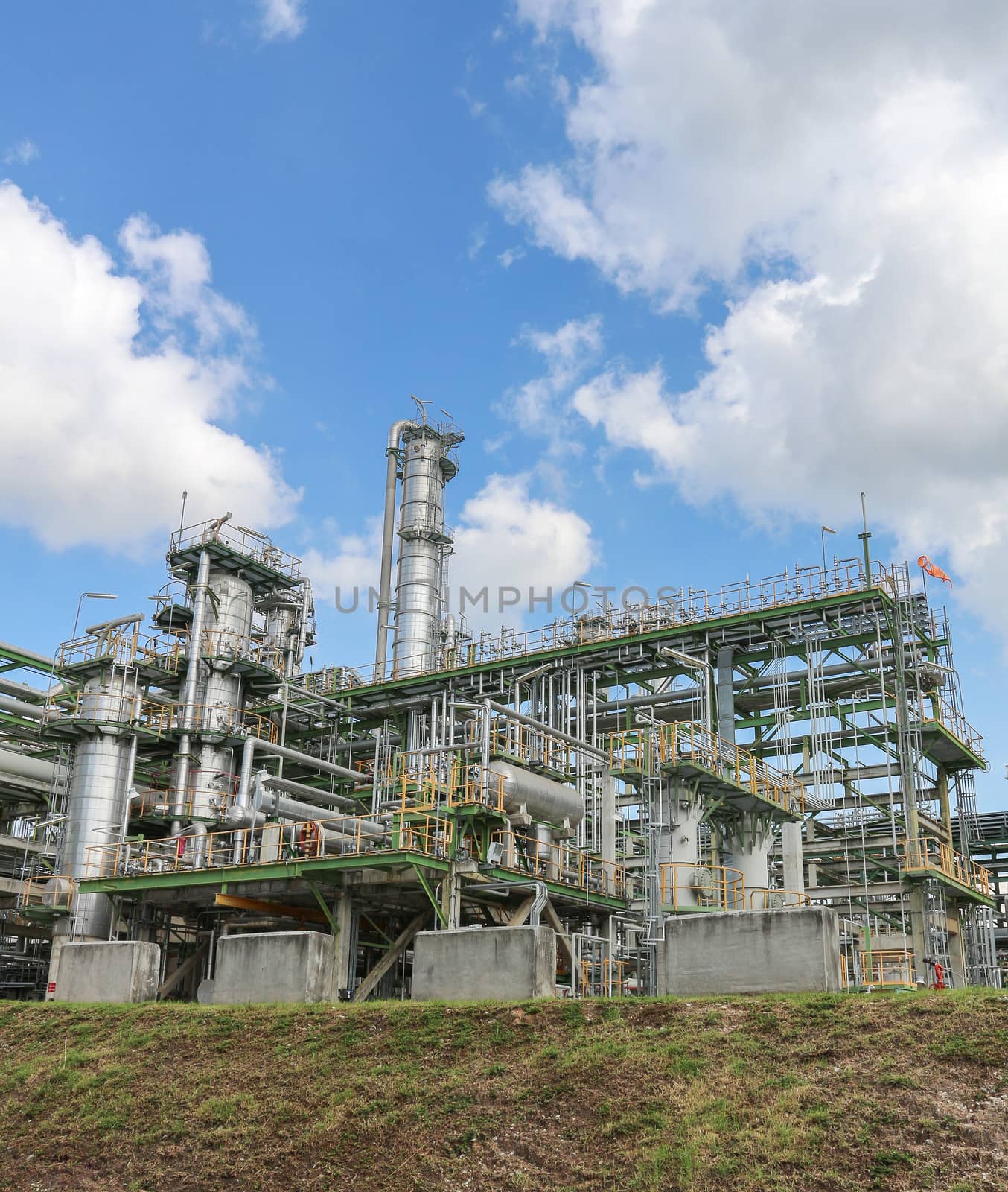 Chemical refinery tower in sunny day