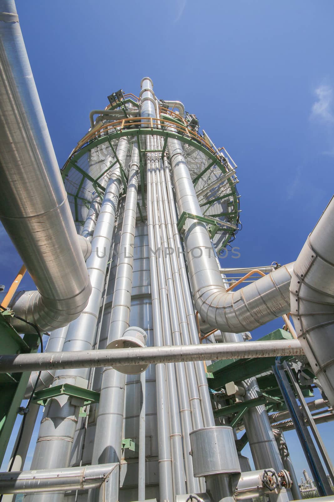 Chemical refinery tower in sunny day