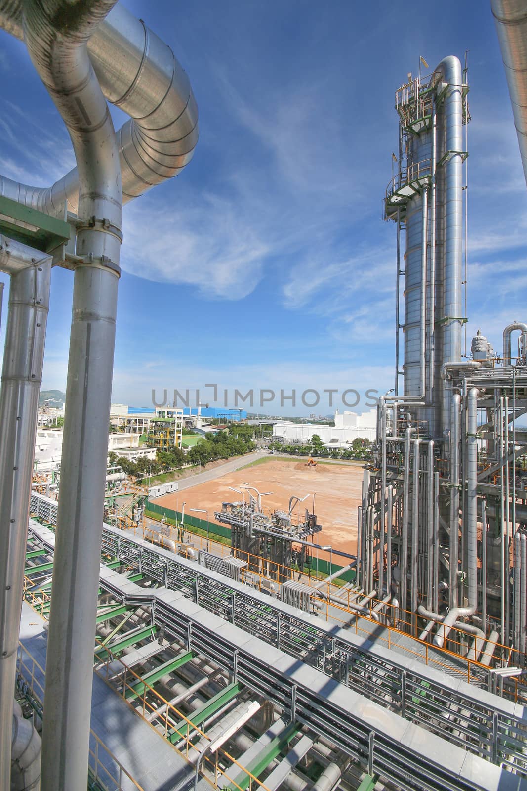 Chemical refinery tower in sunny day