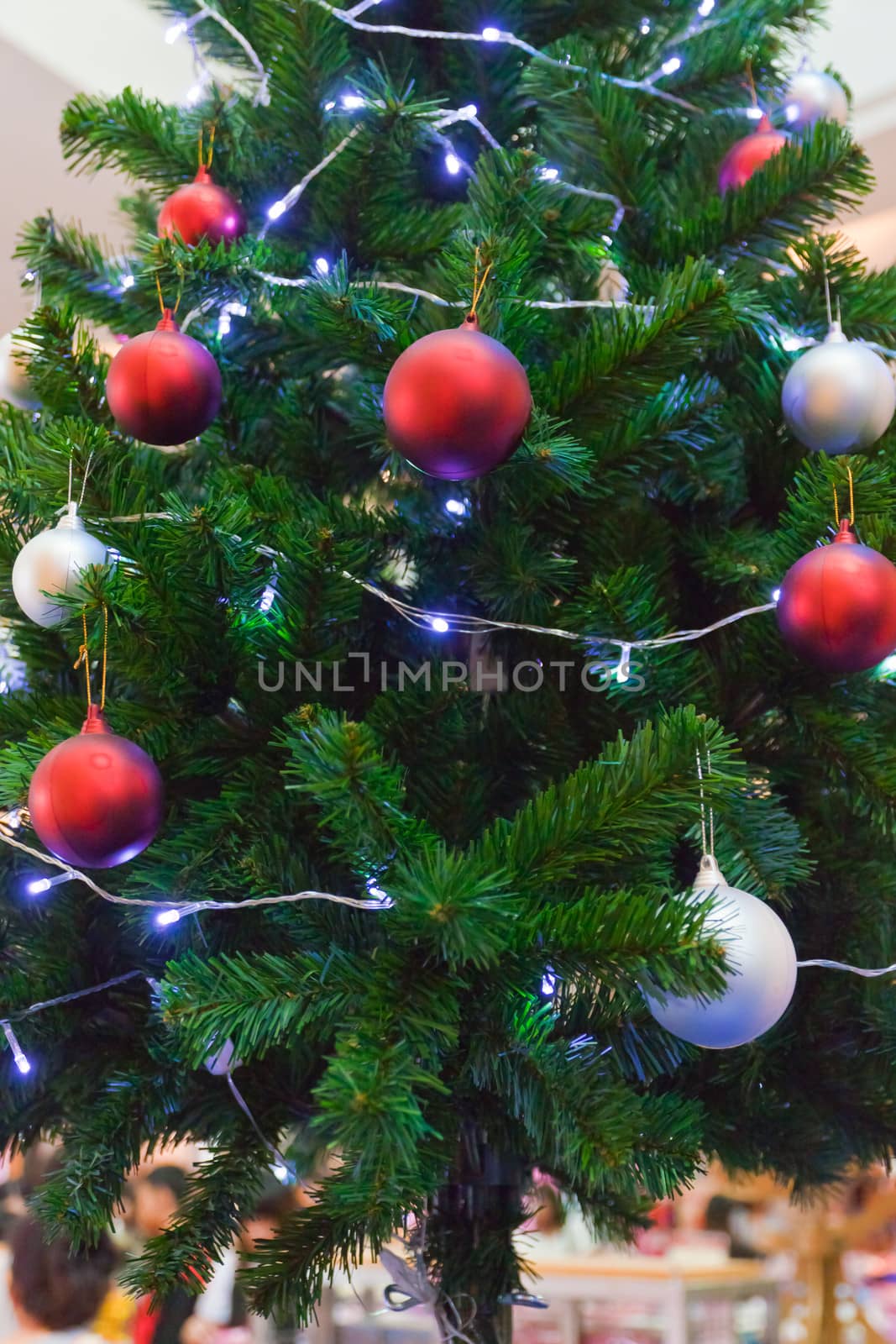 Background image of a Christmas tree decorated with lights by nikky1972