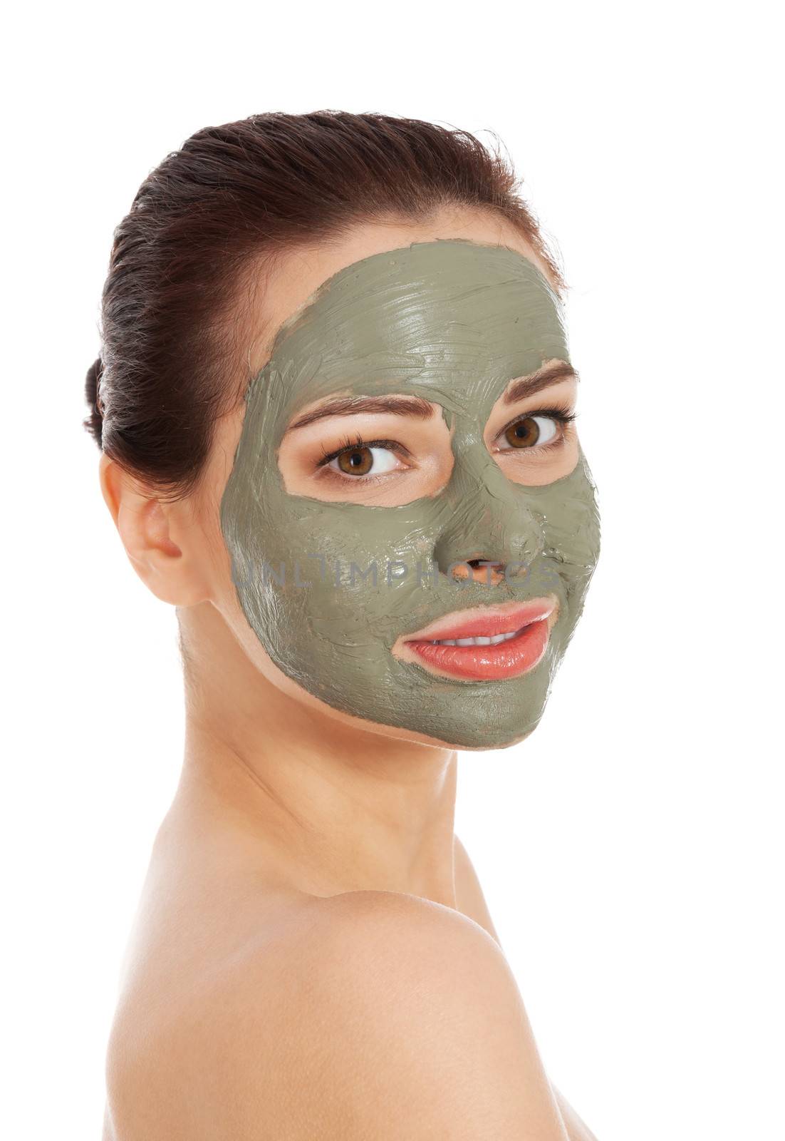 Beautifu toplessl woman with facial mask. Spa concept. Isolated on white.