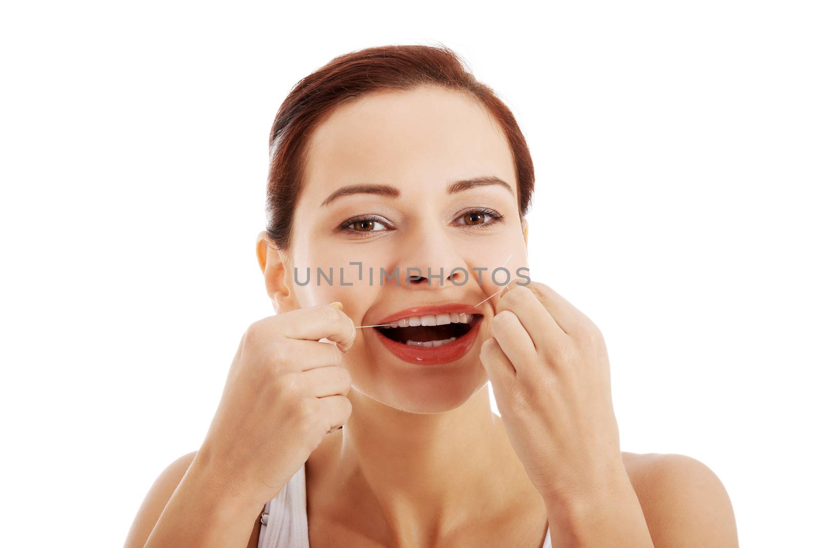 Beautiful young woman with dental floss. Isolated on white.