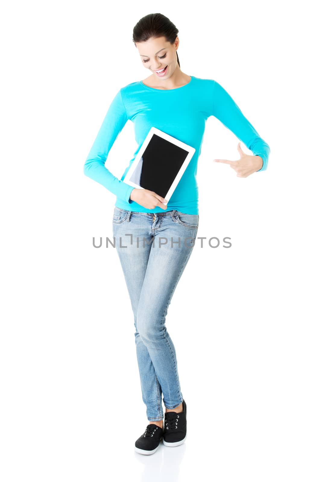beautiful casual woman holding a tablet. Isolated on white.
