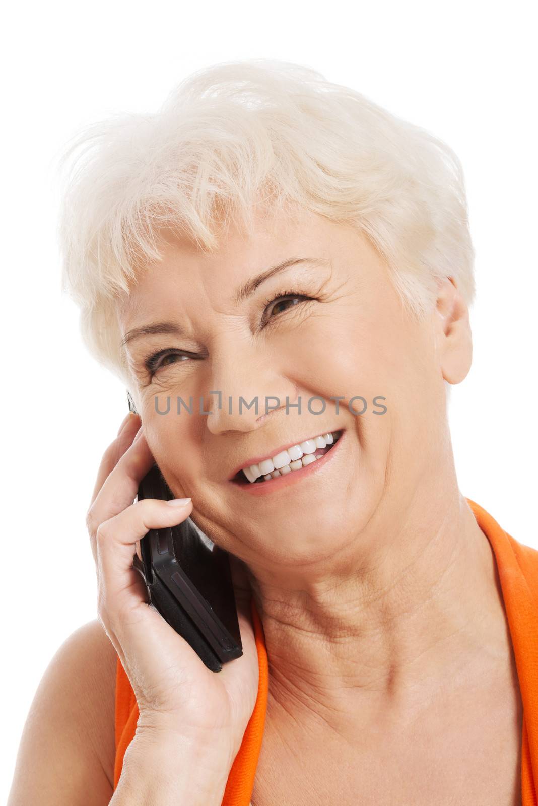 An old woman talking through phone. Isolated on white.