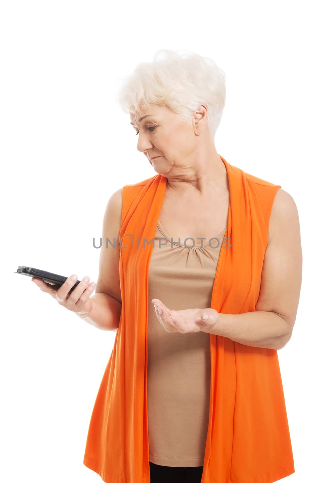 An old lady using mobile phone. Isolated on white.