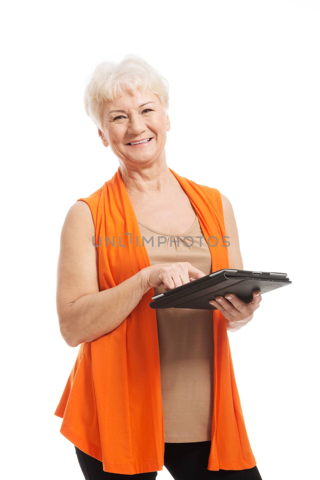 An old lady with tablet. Isolated on white.