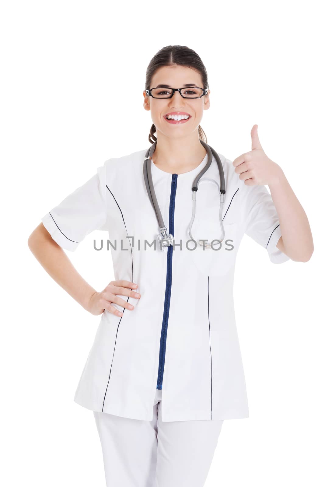 Young beautiful doctor, nurse with stethoscope showing ok. Isolated on white.