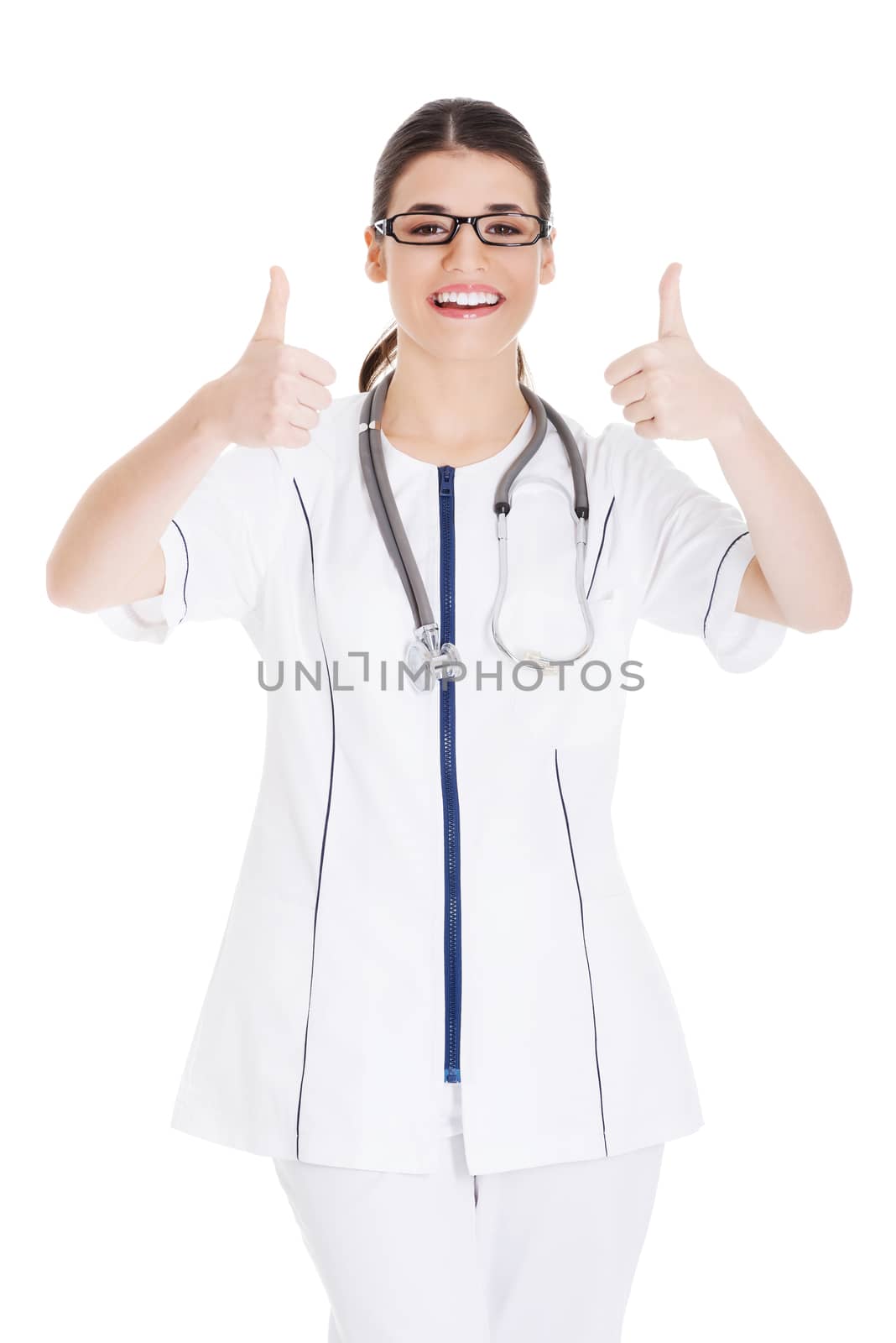 Young beautiful doctor, nurse with stethoscope showing ok. Isolated on white.