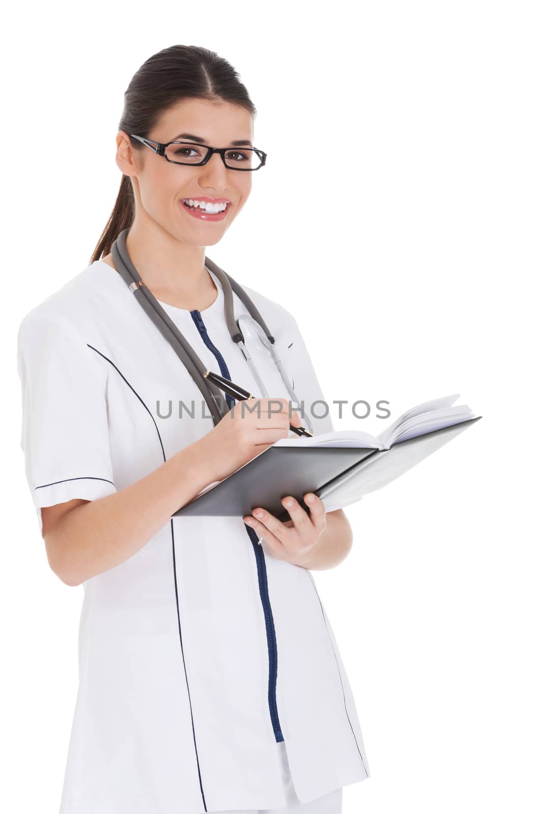 Young female doctor wirting in a book. by BDS