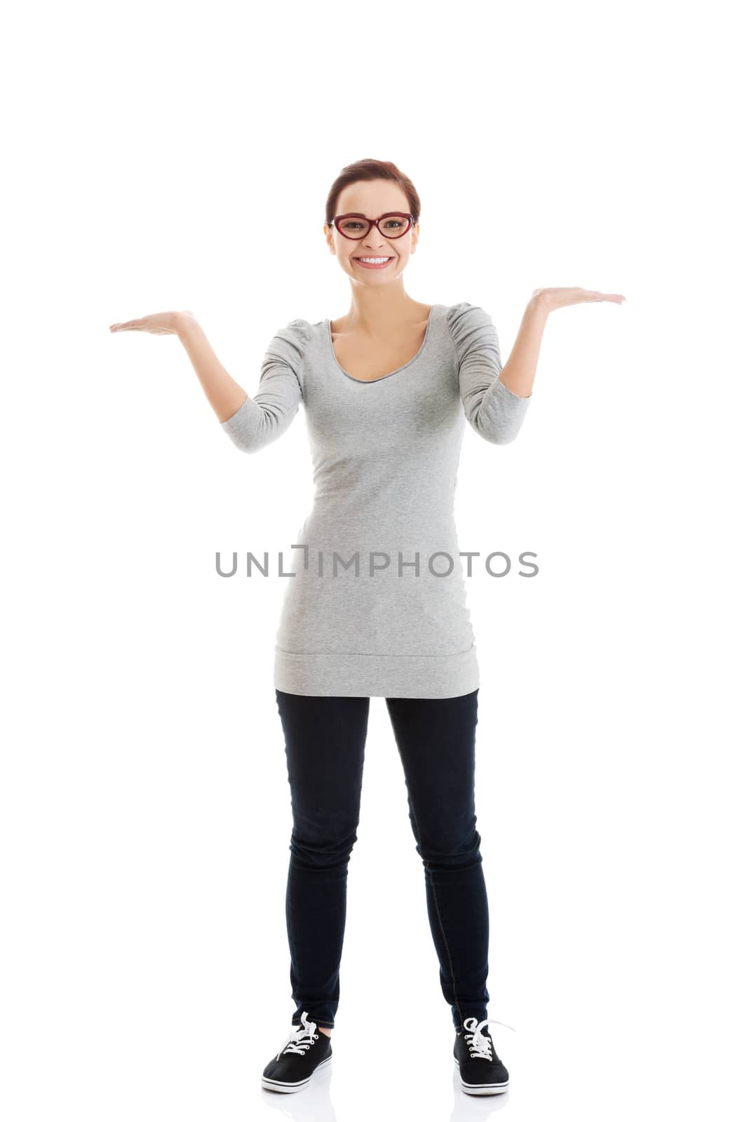 Beautiful casual woman with empty copy space on hands. by BDS