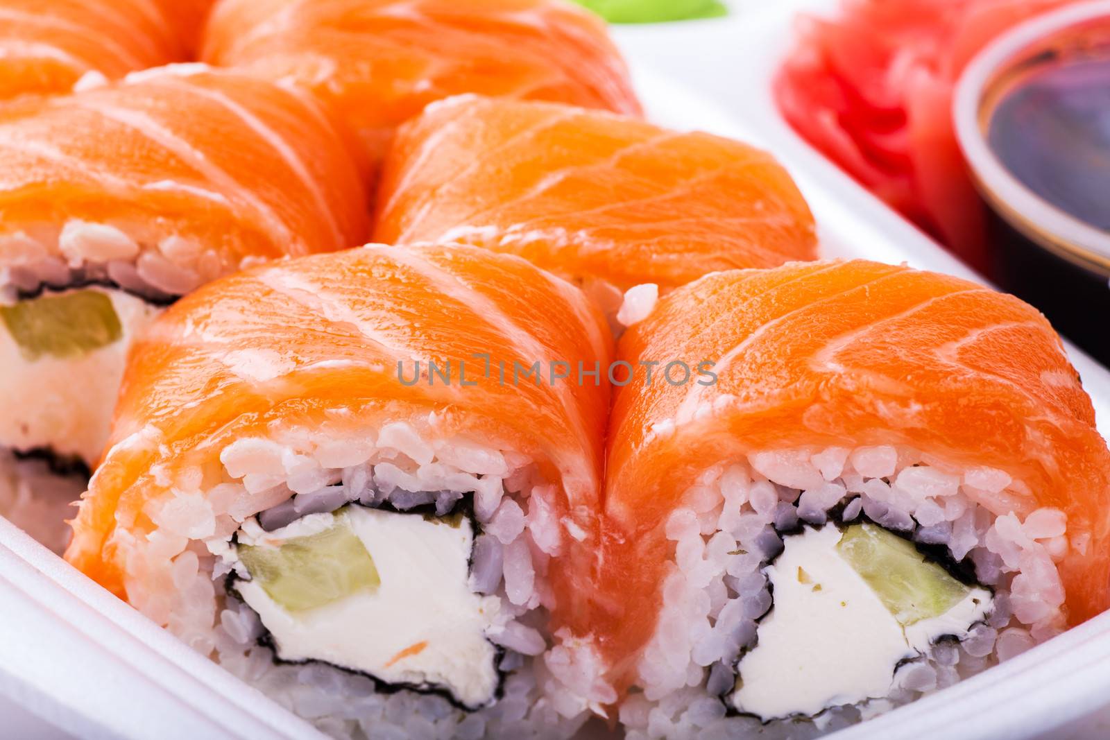 Sushi, soy and ginger on a white plate