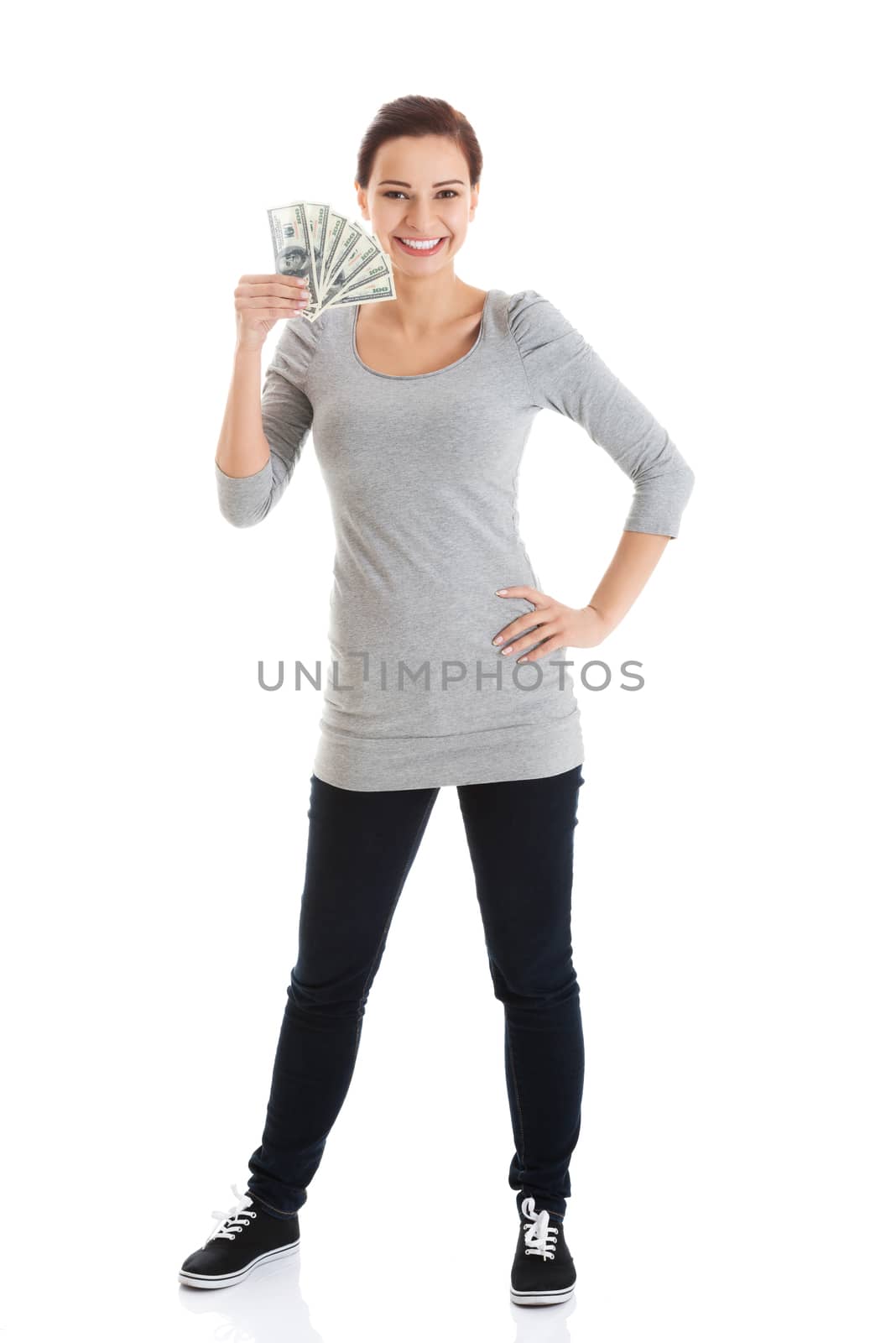 Beatiful casual woman holding money. by BDS