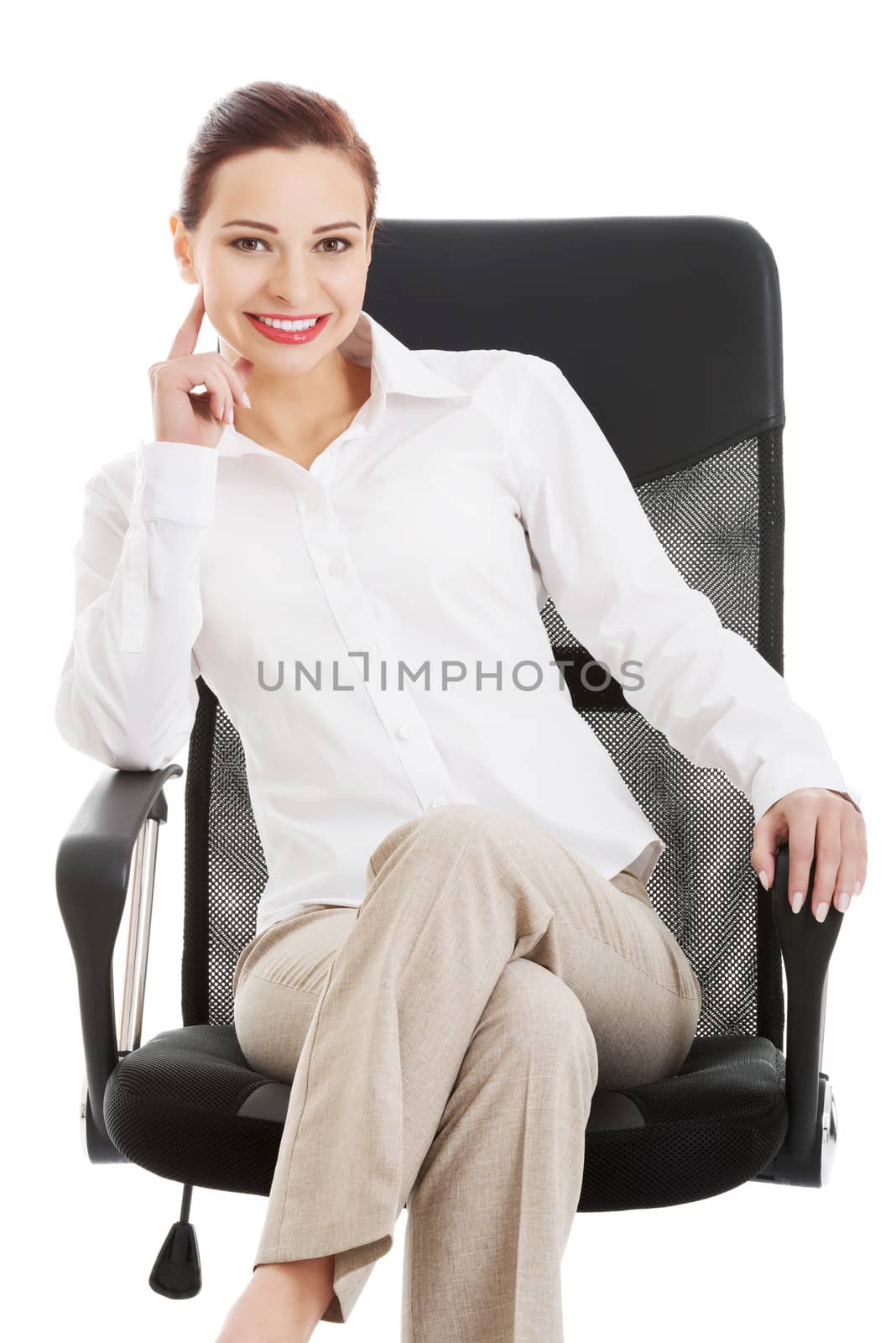 Beautiful business woman, boss sitting on a chair. Isolated on white.