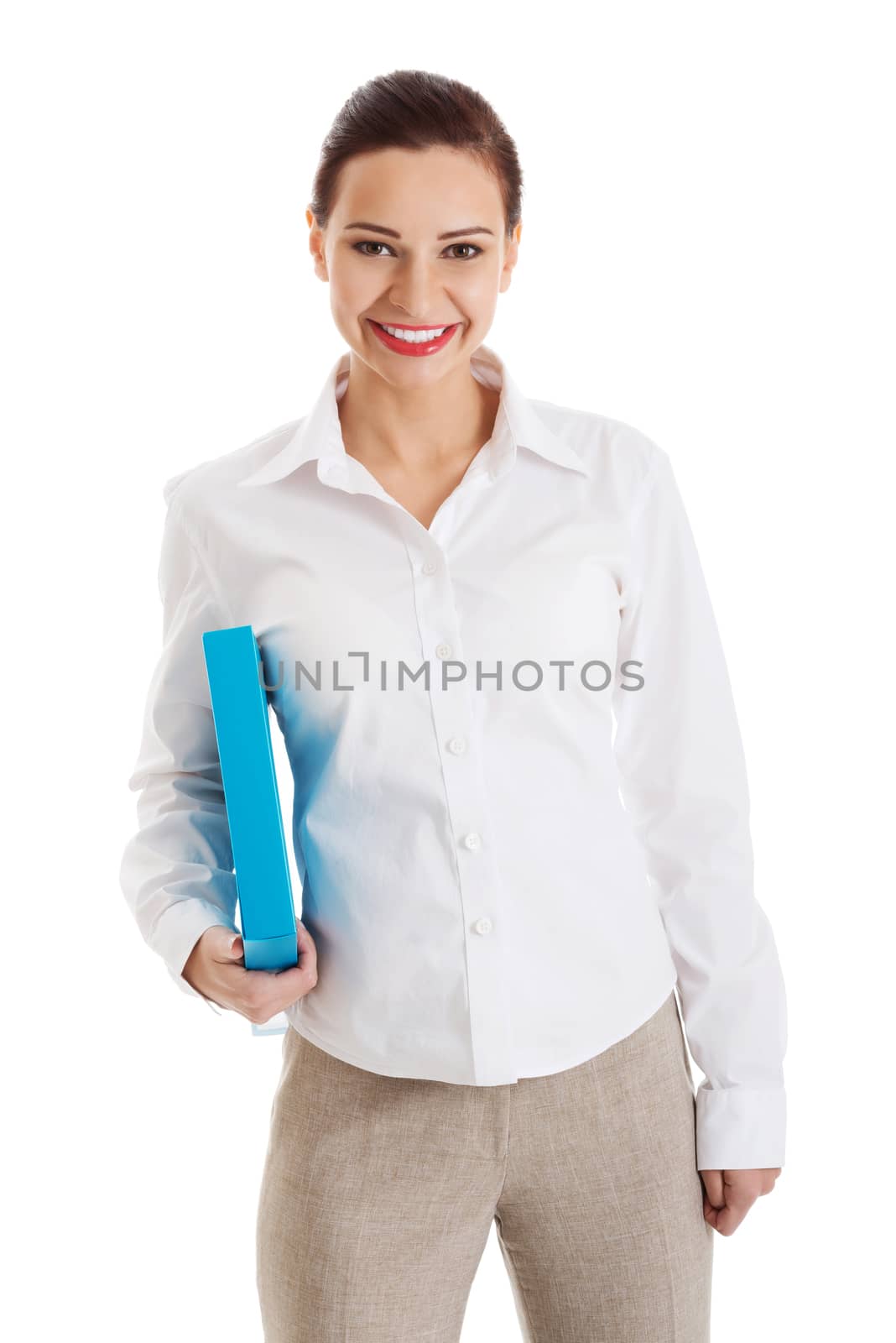 Beautiful young business woman holding file. Isolated on white.